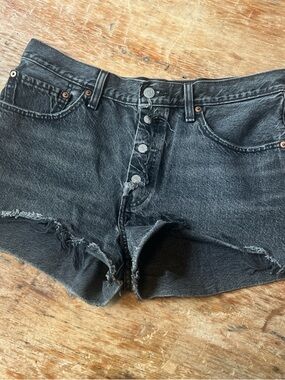 Levi’s distressed black denim shorts